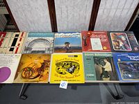 Top down photo showing 10 assorted vinyl albums with various classical and music themes arranged in two rows.