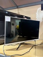 Front view of Viotek 32-inch LED tabletop monitor showing black screen and silver bezel on a silver metal stand.