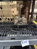 Black wire owl candle holder with 4 owl mineral stone sculptures on a metal shelf, showing overall shape and style.