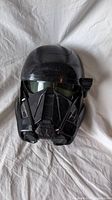 Front view of the black Star Wars Death Trooper mask showing molded details and tinted visor.