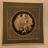 Full view of square Burmese Kalaga tapestry in gold frame showing central embroidered figure on bird with intricate beadwork.