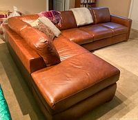 Two sections connected to form full L-shaped sofa from angled front