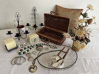 Full view of entire lot with all items arranged on table against plain wall