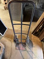 Photo of smaller dolly showing metal frame and solid wheels