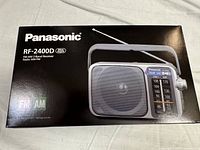 Box showing Panasonic RF-2400D portable radio with AM/FM label on front and radio image.