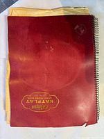 Front cover of red Natflat spiral-bound notebook