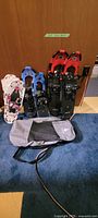 Front view of all three pairs of snowshoes and carrying bag