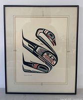 Full view of the framed First Nation art print, showing design and signature.
