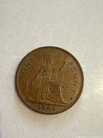 Obverse side showing Seated Britannia with trident and shield, dated 1964.