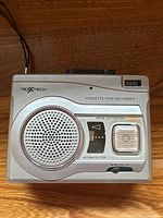 Top view showing speaker, voice activation, automatic stop, microphone and hand strap