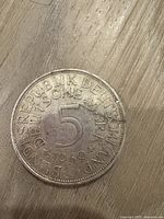 Close up image of the obverse side of the coin showing denomination '5', year '1969', and inscription 'BUNDESREPUBLIK DEUTSCHLAND'.