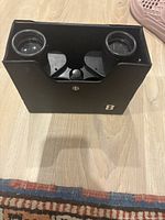 Black Bushnell Falcon 7x35 binoculars, viewed from front showing both lenses and central focusing mechanism