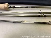 Closer view of cork handle, rod sections, and one guide ring of Hardy Zenith Sintrix fly rod.