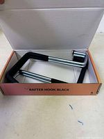 Four heavy duty black metal rafter hooks in original pink Huhole box