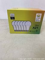 Front view of the LED bulb pack showing 6 bulbs on box front, brightness 2300 lm, 19W power rating