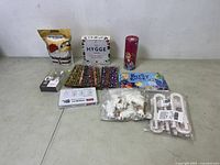 Overview photo showing all items including food, stationery, toys, ornaments, and clips.