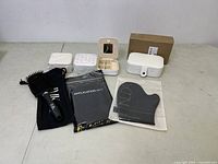 Wide shot of all items including jewelry boxes, application mitts, hairbrush and cases