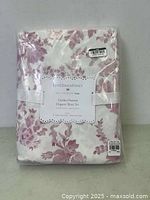 Shows full packaged sheet set with the pink floral pattern on white background and label.