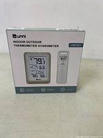 Front view of sealed box showing digital display and sensor image, model UN0581