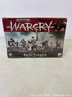 Front view of the sealed Warhammer Warcry Spire Tyrants box showing logo, faction name, and miniatures artwork.