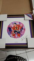 Framed lithograph in packaging with visible signature and artwork of Stan Mikita in Chicago Blackhawks jersey with number 21