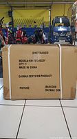 Boxed bike trainer model KW-7073-0220 showing front label with product details and certification