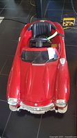 Front view of the red ride-on Mercedes toy car showing steering, seat and hood detailing