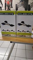 Front view of two SoleSkate boxes showing product image and branding