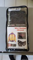 Front view of packaged Venture Heat 12V Heated Gloves showing branding and product type.
