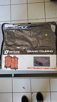Front packaging of Venture Heat Grand Touring Collection 12V Heated Vest Liner showing product image and branding.