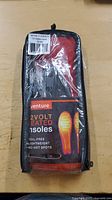 Front view of packaged Venture 2 Volt Heated Insoles showing product name, features including coil-free, lightweight, and no hot spots in heat distribution.