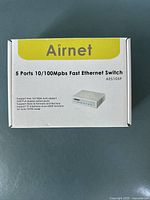 Front view of the Airnet Ethernet switch box showing model and key features.