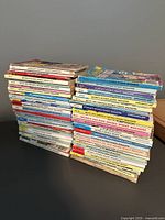 Two stacks of vintage Archie Comics Double Digest magazines showing various titles including Betty & Veronica and Jughead, with visible wear and some imperfections.