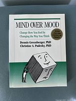 Front cover of 'Mind Over Mood' showing title, authors, and cover art.