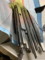 Photo showing four metal drawer rails in a bag, silver color, for 21-inch drawers.