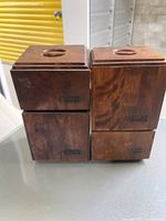 Four vintage wooden cannisters stacked two by two, showing front labels for coffee, tea, sugar, and flour, made by Baribocraft.