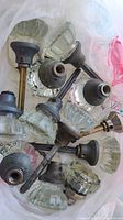 Group of antique glass door knob sets in bag