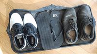 Tray holding women’s golf shoes, men’s shoes, flip-flops