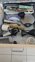 Overview of drawer with all listed kitchen items