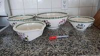 Five ceramic bowls on countertop showing size graduation and pattern