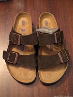 Top view of the black Birkenstock sandals showing the suede straps and footbed with size 40 marking.