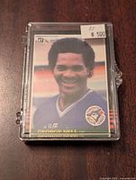 Front of 1985 Donruss George Bell Toronto Blue Jays baseball card in protective plastic case with price sticker showing $5.00.