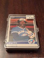 Front of 1984 Fleer Jorge Orta baseball card showing player in Blue Jays uniform, priced at $7.00
