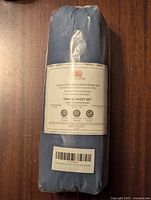 Front view of the sealed luxury 1000 series microfiber sheet set packaging showing label with product details and color.