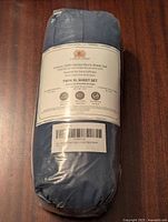 Photo of front label of the sheet set packaging showing brand, series, size and fabric details.