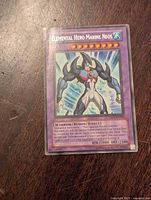 Front view of the Elemental Hero Marine Neos Yu-Gi-Oh card showing the character image, card name, and stats.