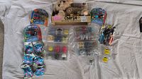 Lot overview showing all items including robot dog, Mashems, and Peppa Pig Lites toys