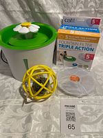 Full lot showing the Catit flower fountain, filter box, extra filter, and yellow mouse toy