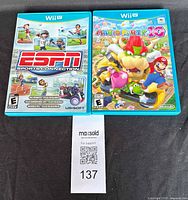 Photo of two Nintendo Wii U game cases side by side showing ESPN Sports Connection and Mario Party 10 games.