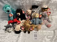 Front view of entire Ty Beanie Babies lot showing diverse animals including husky, lobster, bears, horse, and others in a group on a white background.